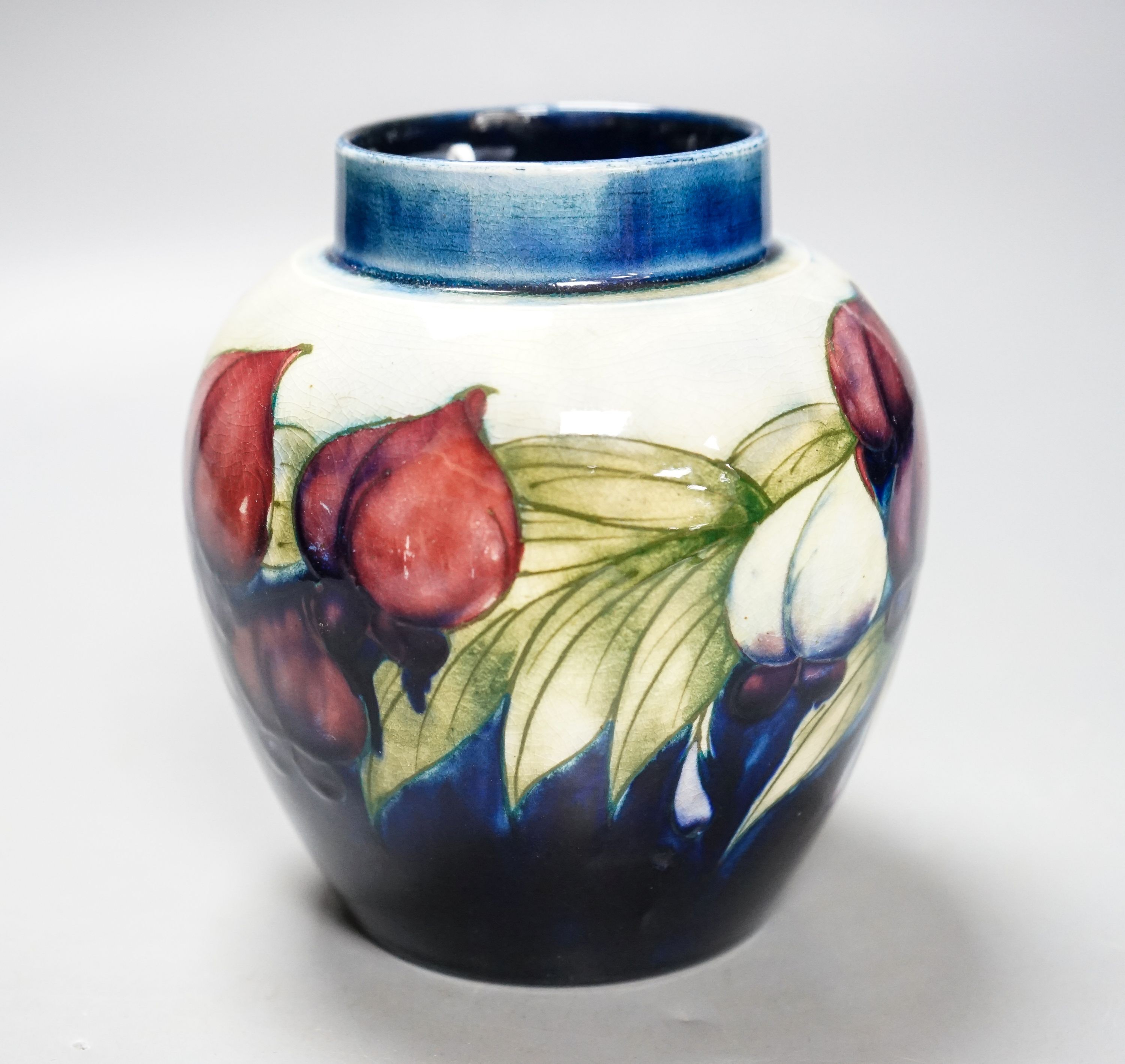 A Moorcroft wisteria pattern jar 13cm